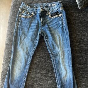 medium wash miss me jeans , relaxed skinny fit, low rise, size 28